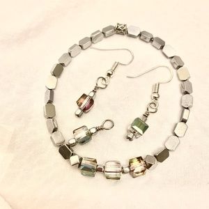 Bracelet, earrings and small pendant.